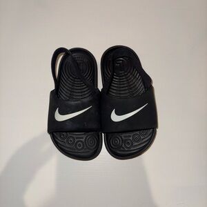 Nike Kids Black Slide Sandals with White Swoosh and Back Strap